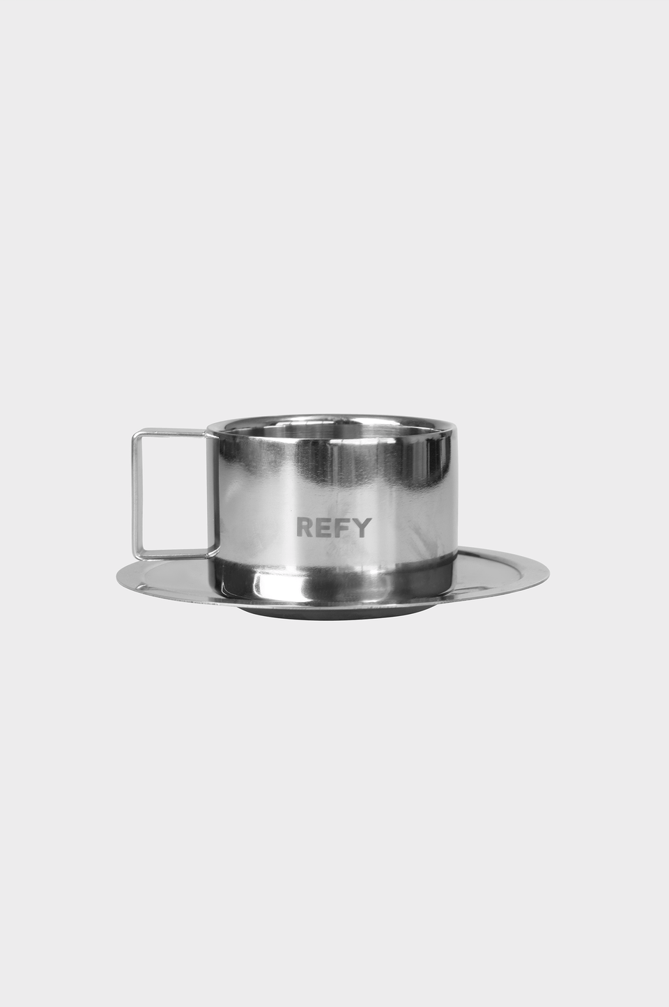 CLOSE UP OF REFY METAL CUP AND SAUCER